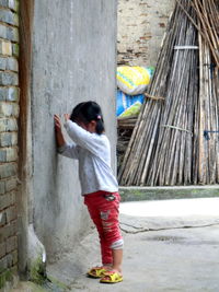 Full length of man standing in front of building