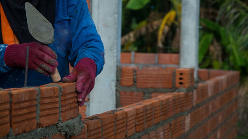 Man working on wall