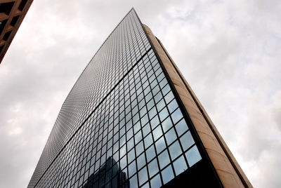Low angle view of skyscraper against sky