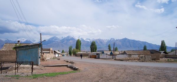 Panoramic view of buildings and mountains against sky