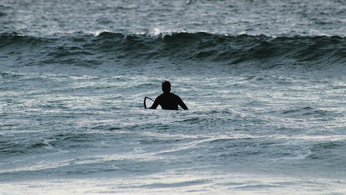 Man swimming in sea