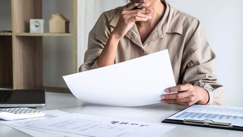 Businesswoman working on table