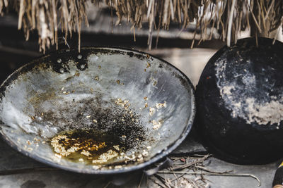 High angle view of old utensils in yard