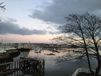 Scenic view of river against sky at sunset