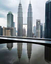 Reflection of buildings in swimming pool