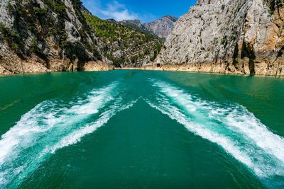 Scenic view of sea against mountain