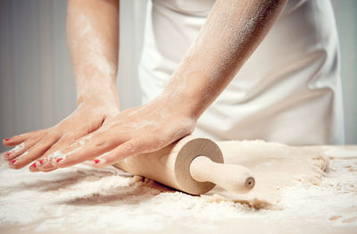 Midsection of woman preparing food