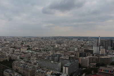 Paris france,  view from the eiffel tower. high angle view of city buildings against cloudy sky