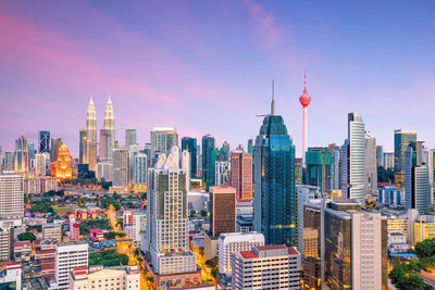 Modern buildings in city against sky