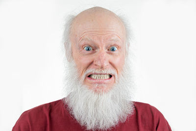 Portrait of man wearing mask against white background