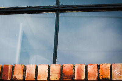Close-up of metal against sky