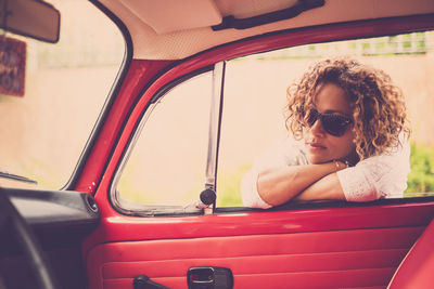 Portrait of boy sitting in car