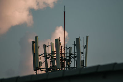 Low angle view of smoke emitting from chimney against sky