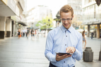 Young man using mobile phone