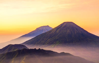 Scenic view of mountain against sky during sunset