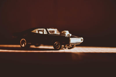 Close-up of toy car against black background