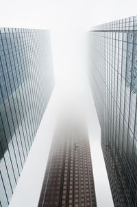 Low angle view of modern buildings against clear sky