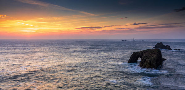 Scenic view of sea against sky at sunset