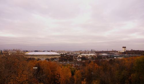 High angle view of buildings in town against sky