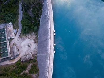 High angle view of swimming pool by sea against sky