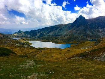 Scenic view of lake surrounded by mountain