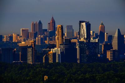 Modern buildings in city against sky