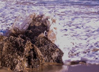 Waves splashing on rocks