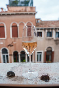 Close-up of wineglass on table