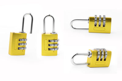 Close-up of padlocks against white background