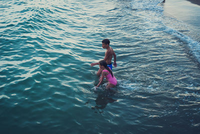 Kids bathing in sea