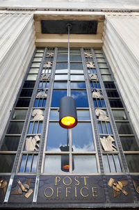 Low angle view of yellow sign on building