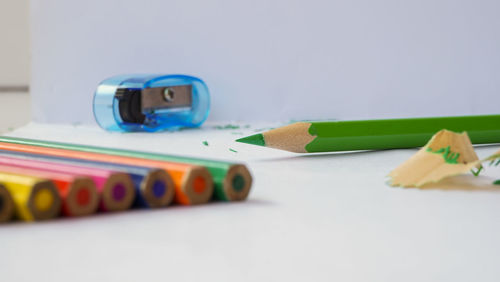 Close-up of colored pencils on table