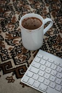 High angle view of coffee cup on table