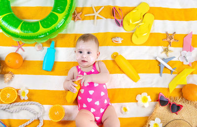 Portrait of cute girl playing with toys