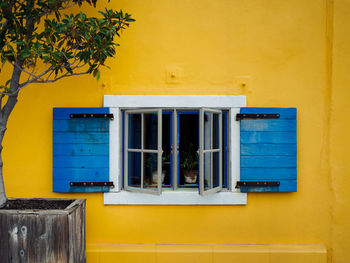 Yellow window on wall