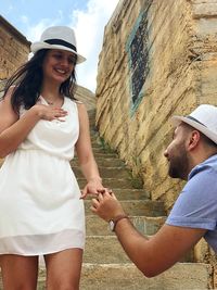 Boyfriend proposing girlfriend in old town