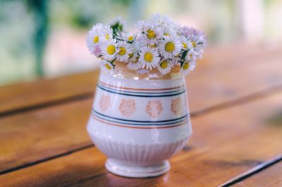 Close-up of flower vase on table