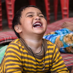 Close-up of boy laughing