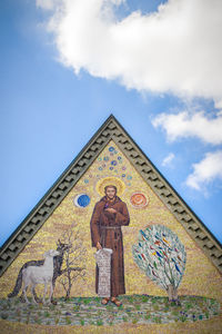 Low angle view of church against blue sky