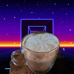 Digital composite image of coffee cup on table against illuminated blue sky