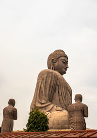 Low angle view of statue against sky