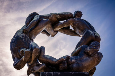 Low angle view of statue against sky