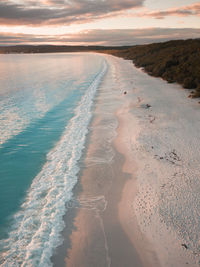 Scenic view of beach against sky during sunset