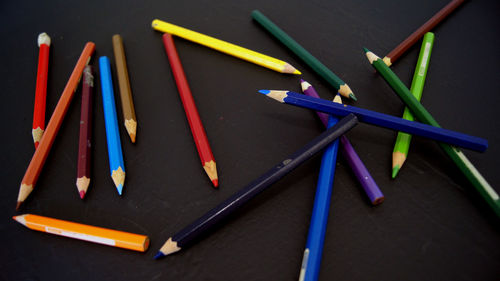 High angle view of multi colored pencils on table