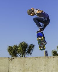 Low angle view of statue against blue sky