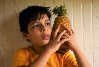 Portrait of boy holding ice cream