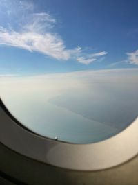 Aerial view of sky seen through airplane window