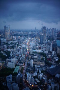 High angle view of buildings in city against sky