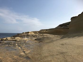 Scenic view of beach against sky