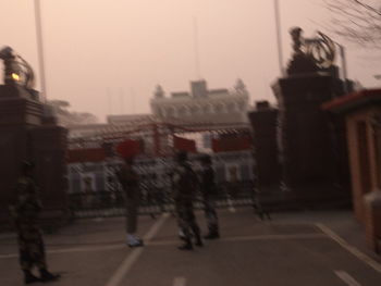 Blurred motion of man on road in city